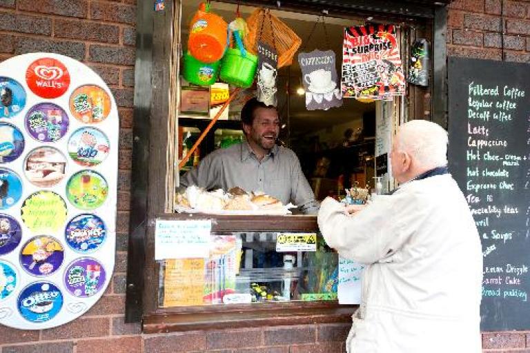 man being served from the teashop