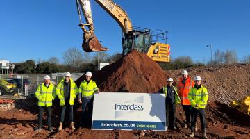 Imre Tolgyesi, assistant director for commercial, assets and estates - pictured third from left - with the team from Interclass on a building site