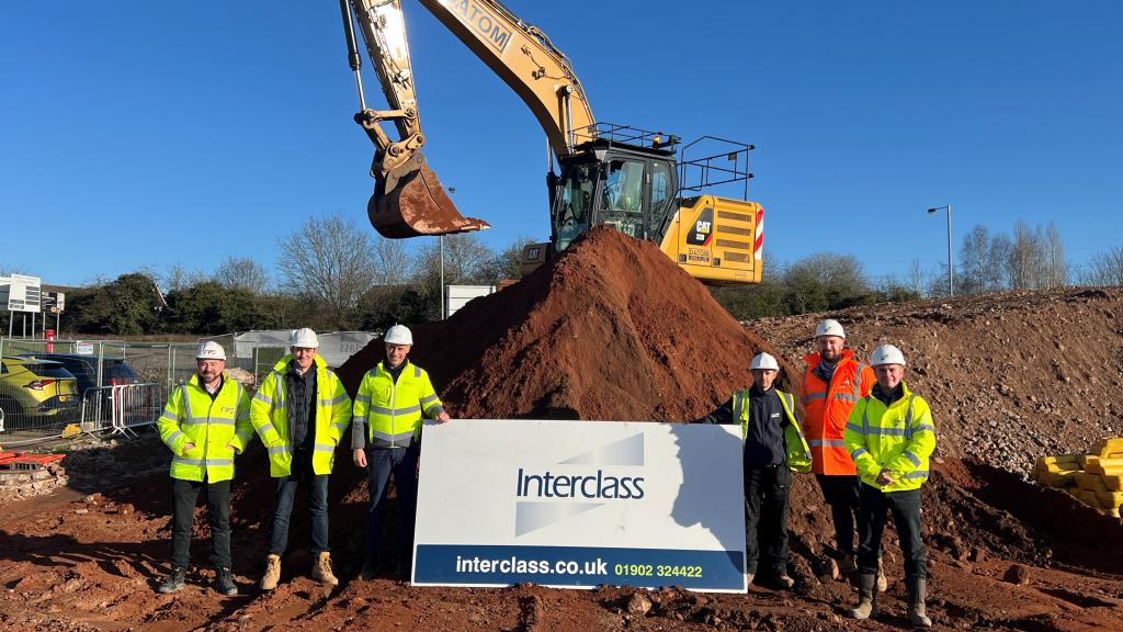 Imre Tolgyesi, assistant director for commercial, assets and estates - pictured third from left - with the team from Interclass on a building site