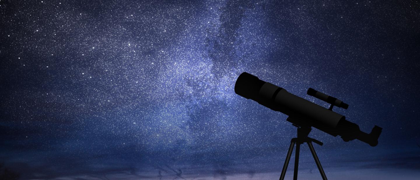 A telescope points to the night sky