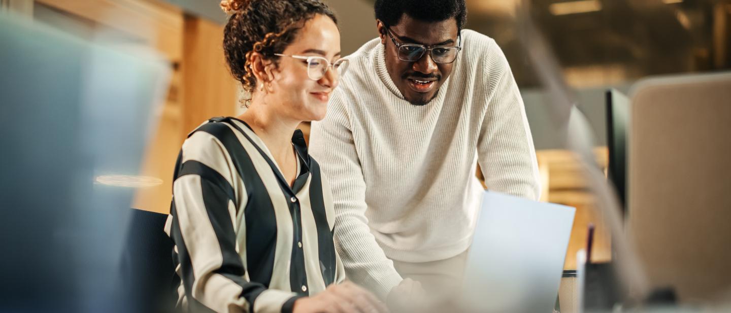 An IT Buddy assists someone with using a computer