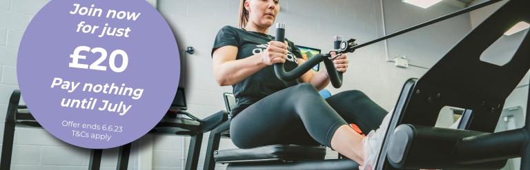 image show lady on rowing machine in gym